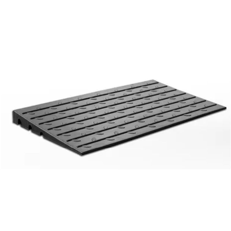 Black rubber threshold ramp with grooved surface for traction, designed to provide smooth transition over doorways and small steps.