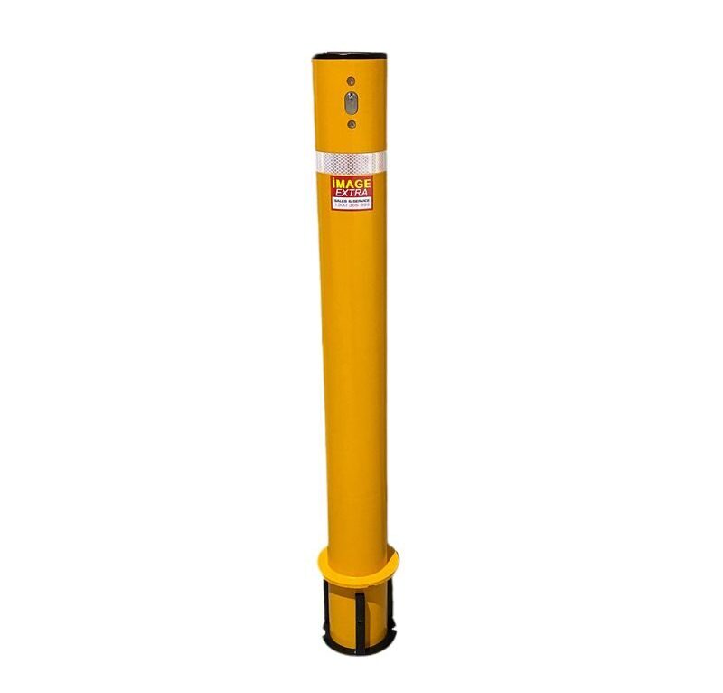 Yellow bollard post with black base and top. Reflective tape and a label are near the top. Safety equipment for traffic control and pedestrian safety.