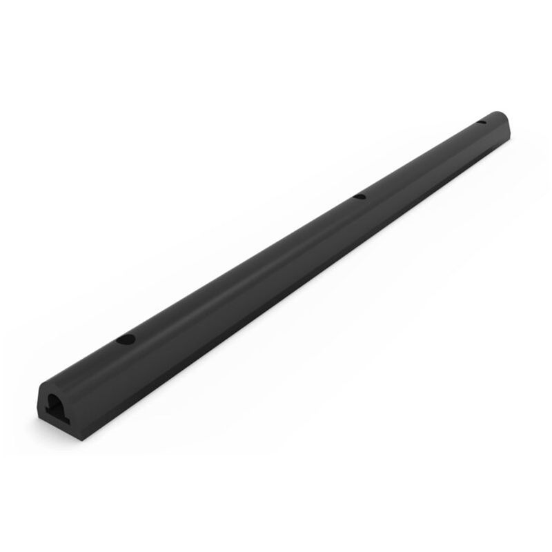 Black rubber parking curb with mounting holes. Parking stop to protect vehicles and property. Car parking bumper.