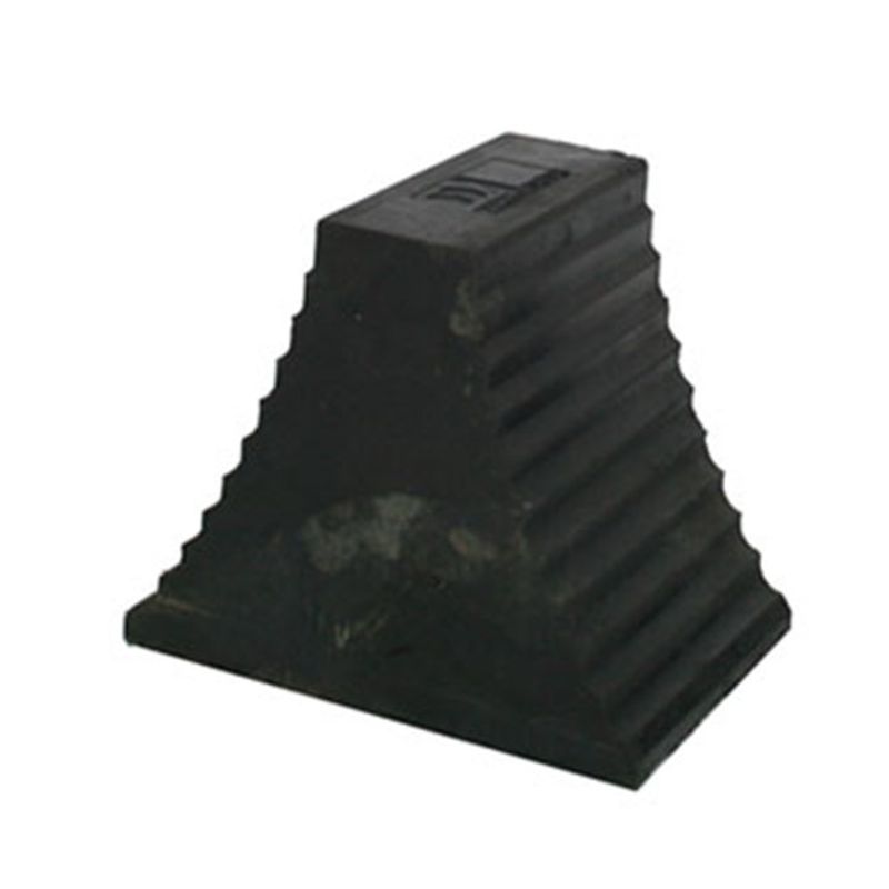 wc2 Wheel Chock Heavy Duty Double Sided - Recycled Rubber 1 Close-up of a black rubber wheel chock. The wheel chock is pyramid-shaped with ridges on the sides and a flat top. Safety equipment.