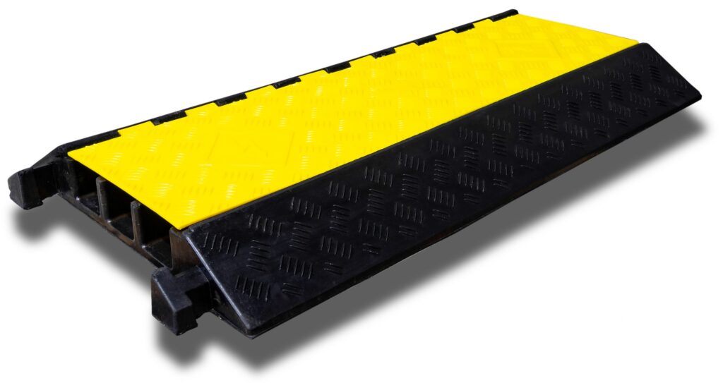 3 chanell cable protector Dugite Rubber Cable Protector - 3 Channel 3 Dugite rubber cable protector, 3 channel. Yellow and black rubber cable ramp with a diamond plate pattern. Cable protection for events.