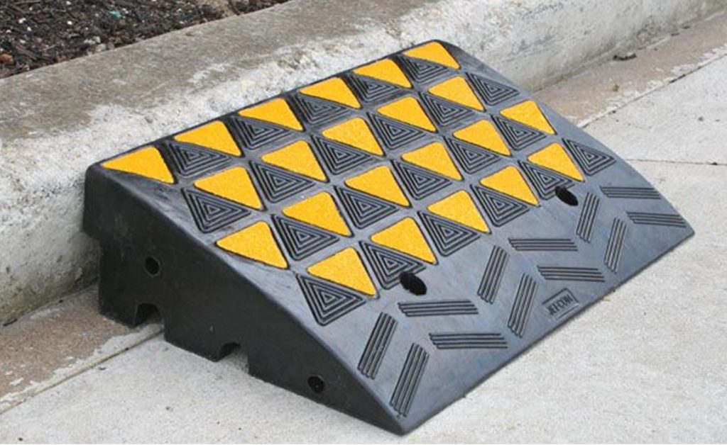KRR150 Hi-Viz Kerb Ramp End Cap Rubber 360mm x 360mm x 150mm - Black/Yellow 6 Black/Yellow Hi-Viz Kerb Ramp End Cap Rubber, 360mm x 360mm x 150mm, with triangular pattern, placed against a kerb.