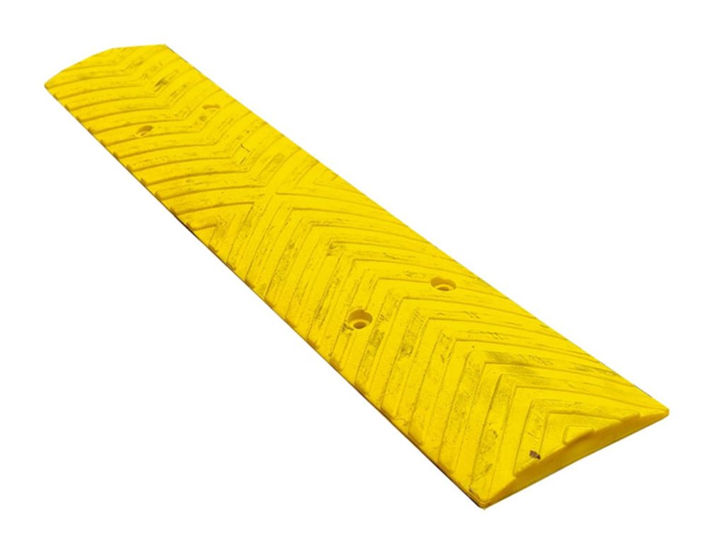 RS500Y Rubber Rumble Strip 500mm - Yellow 9 Close-up of a yellow 500mm rubber rumble strip. The rumble strip has a textured surface with chevron patterns and mounting holes.
