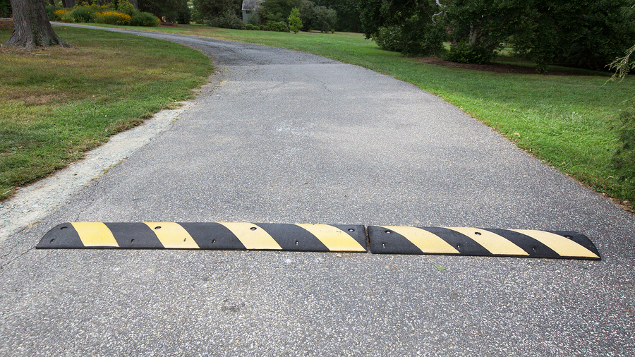 Speed Hump Are Speed Humps Actually Effective? 1 A speed hump with yellow and black stripes on a paved road. Are speed humps effective for traffic calming?