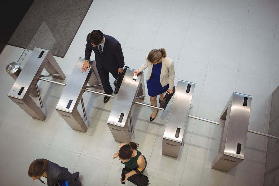 Overhead view of people using turnstiles. Maintain your boom gates and turnstiles for smooth operation.
